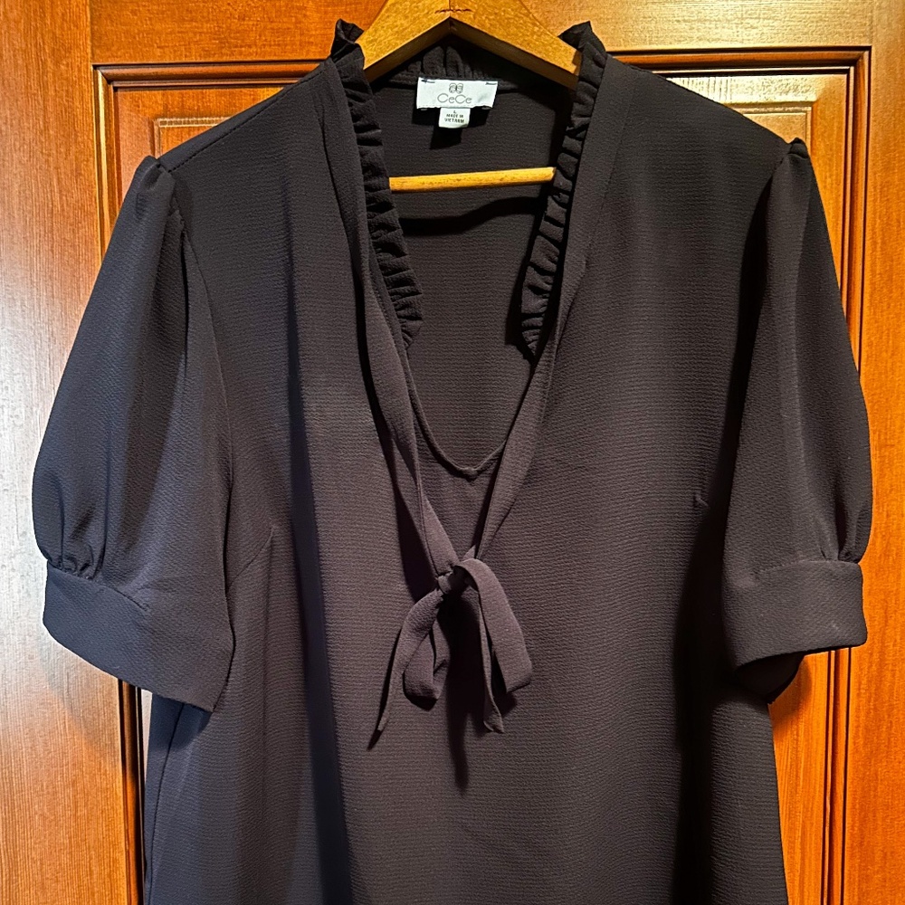 Navy blue blouse with shirred collar and tie detail